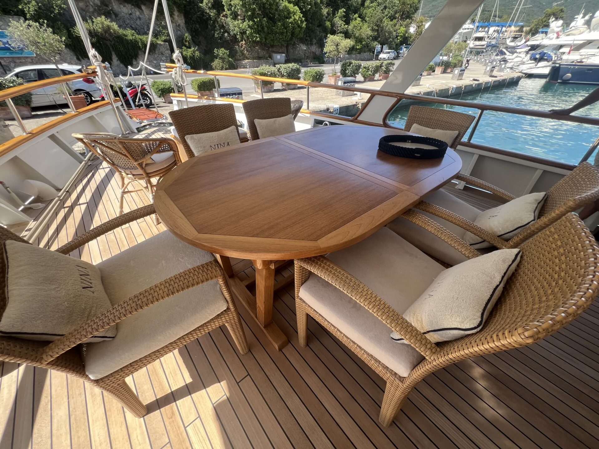 Cockpit dining table on classic motor yacht for charter